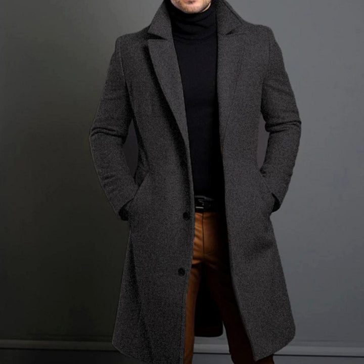 Desmond charcoal grey tailored long overcoat with notched lapel, front view