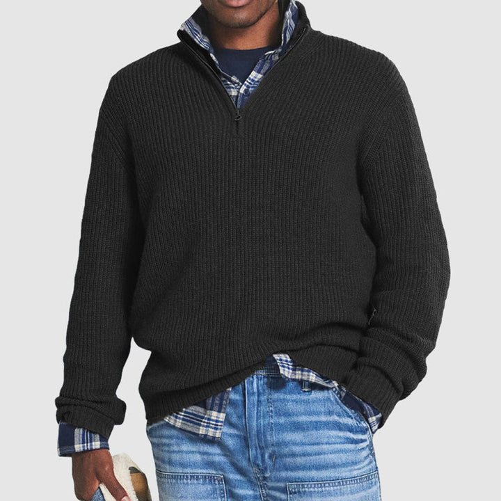 Julian ribbed quarter-zip knit sweater in black, front view layered over plaid shirt