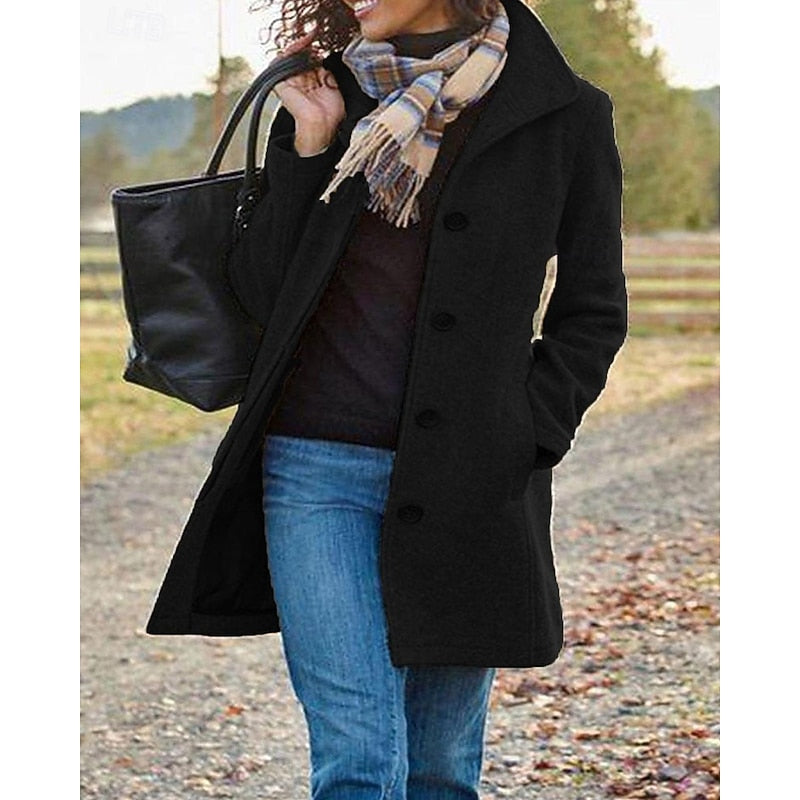 Rosalind turndown collar winter coat in black, full front view with tote bag