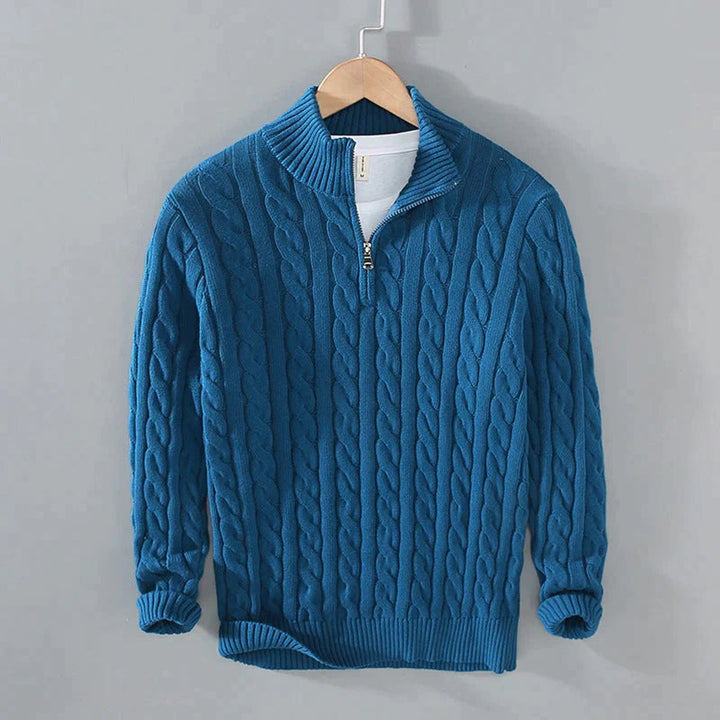 Sebastian cable knit quarter zip sweater in teal blue, front view on hanger
